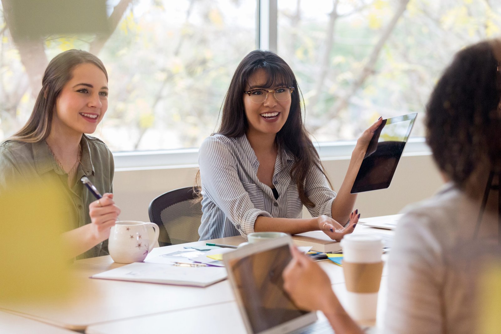 Procheck team sitting around discussing asbestos audits and new clients